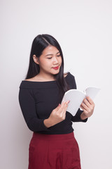 Young Asian woman read a book.