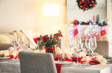 Table served for Christmas dinner in living room