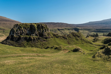 Obraz premium Mystic Fairy Glen, a romantic green valley with strange stone structures on the Isle of Skye, Scotland