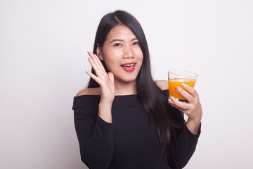 Happy Young Asian woman drink orange juice.