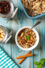 Traditional, mexican baked sweet rice, with almonds, raisins and walnuts.