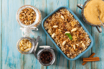 Traditional, mexican baked sweet rice, with almonds, raisins and walnuts.