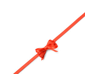 Red ribbon with bow on white background