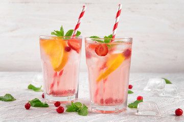 Fresh summer cocktail in glasses on light table
