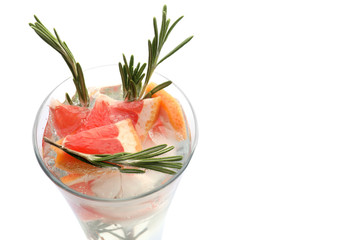 Fresh grapefruit cocktail with rosemary in glass on white background
