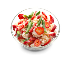 Bowl with tasty boiled rice and vegetables on white background