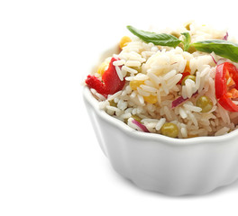 Bowl with tasty boiled rice and vegetables on white background
