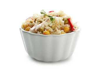 Bowl with tasty boiled rice and vegetables on white background