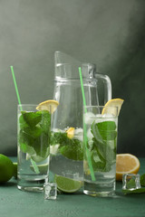 Composition with fresh mojito on green table