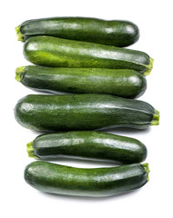 Fresh zucchinis on white background