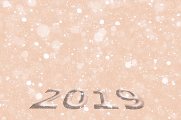 New Year or Christmas background 2019. Background with a volume inscription, bokeh effect. Can be used for postcards, posters, invitations, banners and brochures. Selective focus, mockup