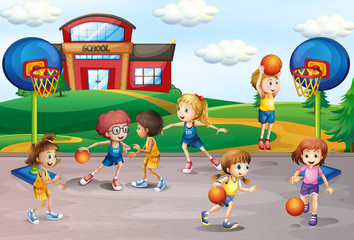 Students playing basketball in physical education