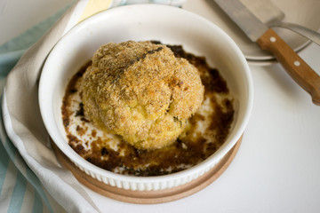 Stuffed cauliflower with chard and bread crumbs. Rustic style.