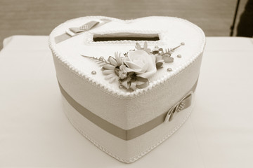 Heart shaped gift box. Beautiful shiny heart shaped gift box. Holidays and celebrations concept.