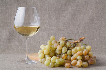 Glass of cold white wine with fruits