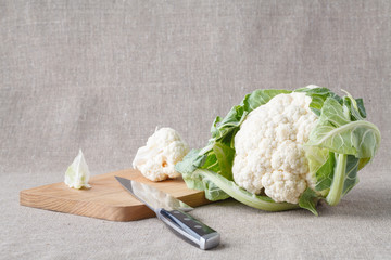 cauliflower on a oak cutting board