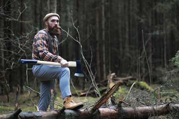 A bearded lumberjack with a large ax 