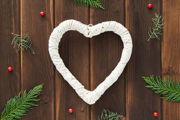 Christmas background for your text and design. The texture of the Christmas gifts, packed in red, blue and craft paper tied with ropes with snowflakes, stars and bows on white wooden boards