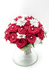 Wedding bouquet made of red roses and pearls isolated on a white background