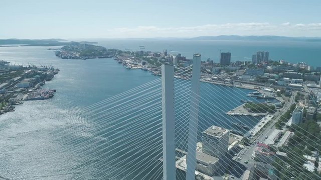 Aerial drone view of The Zolotoy Golden Bridge. Cable-stayed bridge across the Zolotoy Rog (Golden Horn) in Vladivostok, Russia
