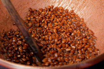 Sugar coated almonds being hand roasted.