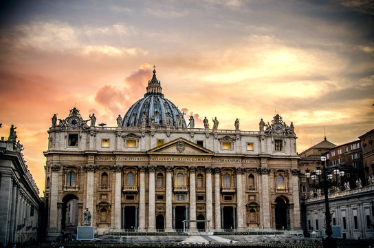 The basilica of St. Peter on the background of an incredibly beautiful sunset sky. Vatican.