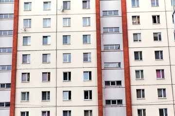 Naklejka premium Multi-storey residential building. Facade with windows