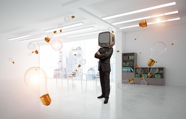 Businessman with an old TV instead of head.