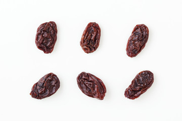 Raisins isolated on white, top view