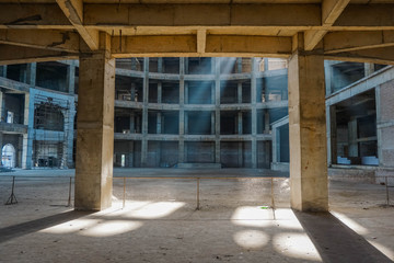 Playing light in a building under construction. Mayapur, India