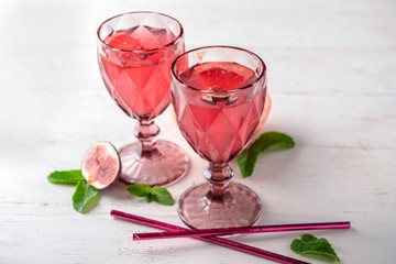 Fresh summer cocktail in glasses on light table