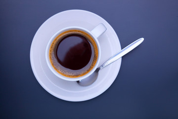 Cup of black coffee on table top view, flat lay, mock up. Cup of Black Coffee in White Ceramic Cup on plastic Tabletop