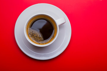 Cup of black coffee on table top view, flat lay, mock up. Cup of Black Coffee in White Ceramic Cup on plastic Tabletop