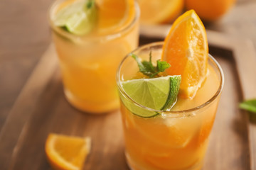Fresh summer cocktail in glass on wooden board, closeup