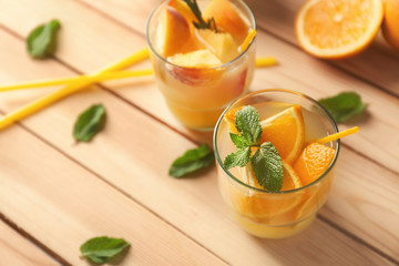 Fresh summer cocktail in glasses on wooden table