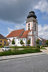 Fototapeta na wymiar Square with church Bechyne
