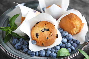 Tasty blueberry muffins on tray