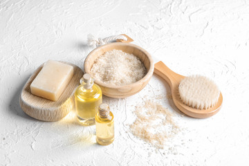 Bath products with brush on white textured background