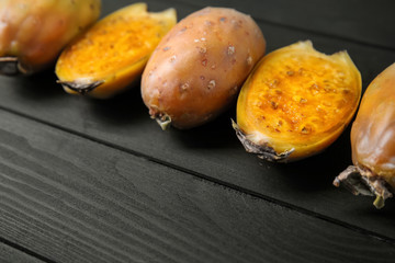 Ripe cactus pears on wooden table