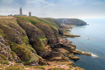 Fototapeta na wymiar Beautiful landscape view of the coastline at Cap Fréhel in Brittany, France, with its lighthouses and steep cliffs in summer 