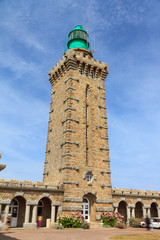 Fototapeta premium Beautiful wide view of the entrance of the new lighthouse at Cap Fréhel in Brittany, France, with a blue sky in summer