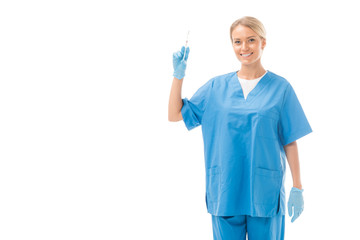 attractive young nurse holding syringe for injection and looking at camera isolated on white