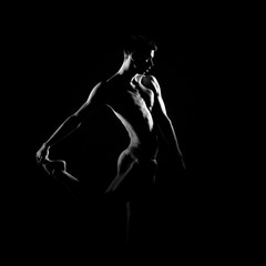 Obraz na płótnie Canvas Black and white silhouette of male ballet dancer.