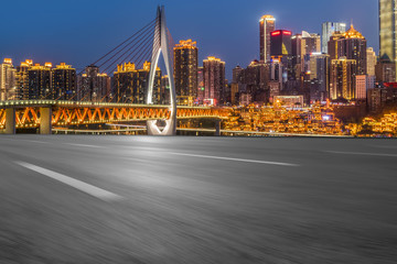 Fototapeta premium Road pavement and Chongqing urban architecture skyline