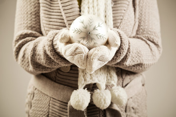 Close up on a person holding Christmas decoration