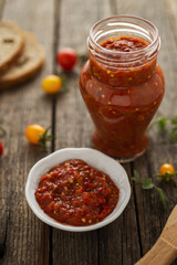 Homemade made lutenica in glass jar on the table