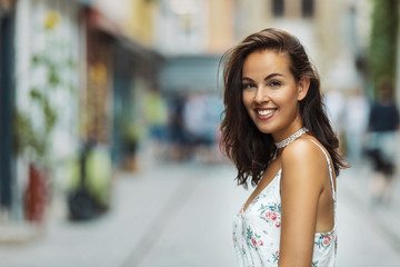 brunette woman smiling into the camera