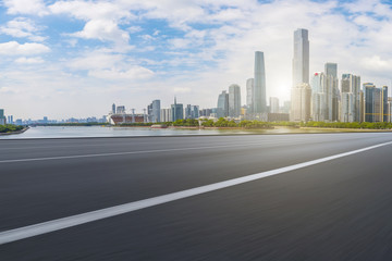 Obraz premium Road pavement and Guangzhou city buildings skyline