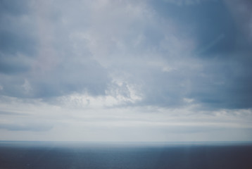 Obraz premium Blue landscape with purple tones. Black sea and dark grey sky seen through the window. Batumi, Georgia