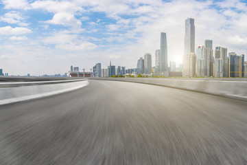 Obraz premium Road pavement and Guangzhou city buildings skyline